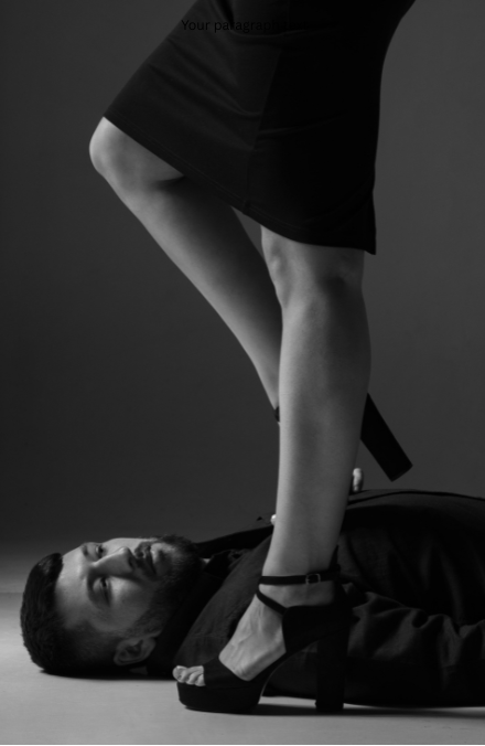 Phone-Sex-Mistress-Sascha-800-601-6875-Phone-Sex-Company.. Man on floor with woman's heel on him.